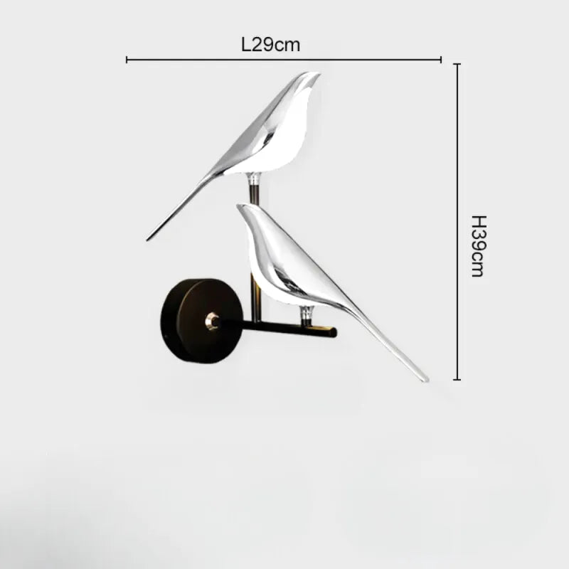 Applique murale Luminaire Essenza avec interrupteur LED rotatif 360°, design oiseau double argent et blanc naturel.