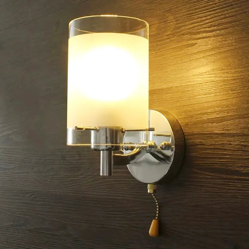 Applique murale cylindrique élégante Luminaire Essenza, design moderne en métal blanc, éclairage doux pour intérieur contemporain