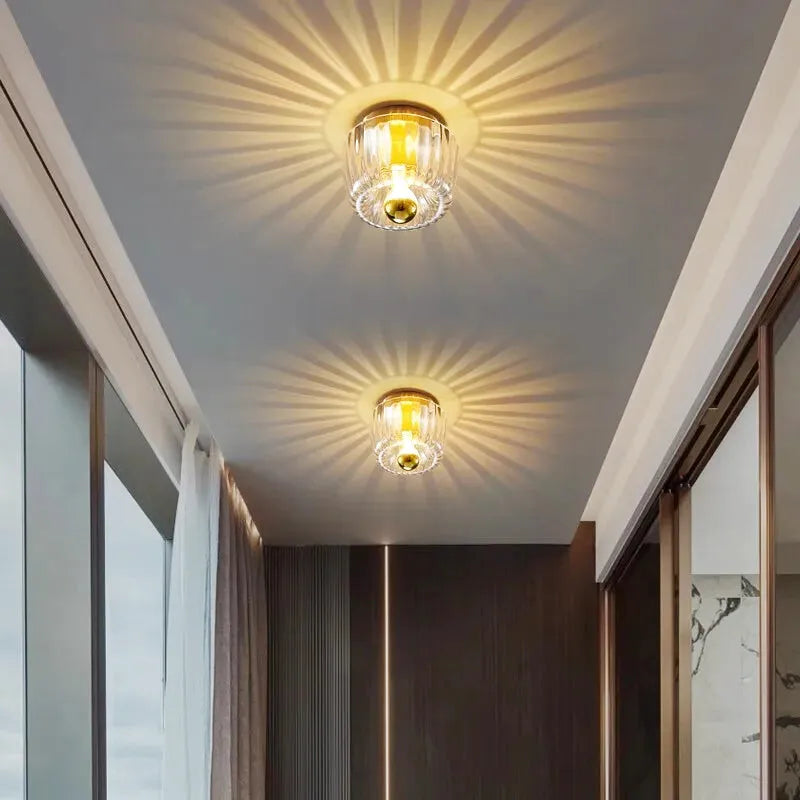 Applique murale en verre avec effet soleil de Luminaire Essenza, design élégant et lumineux pour décoration intérieure.