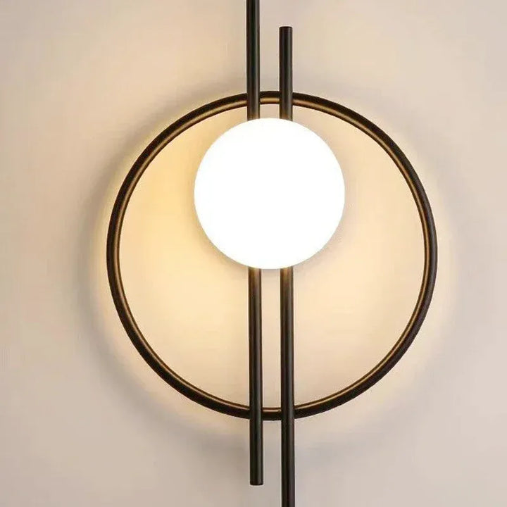 Applique murale LED moderne en forme de sphère, finition noire et blanche, éclairage froid, design élégant de Luminaire Essenza.